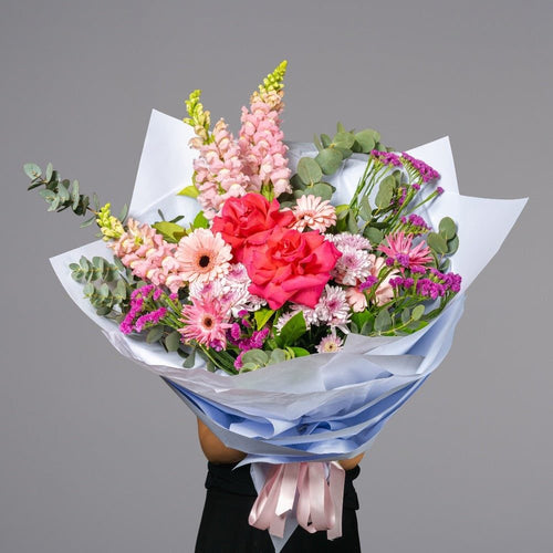 Classic Flamingo Bouquet of red roses and pastel pink flowers
