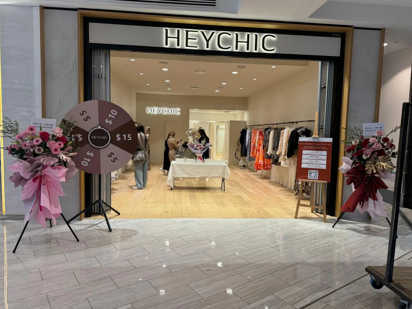 Shop opening flowers: two grand-opening flower stands at the entrance of a new fashion store in a Sydney shopping centre