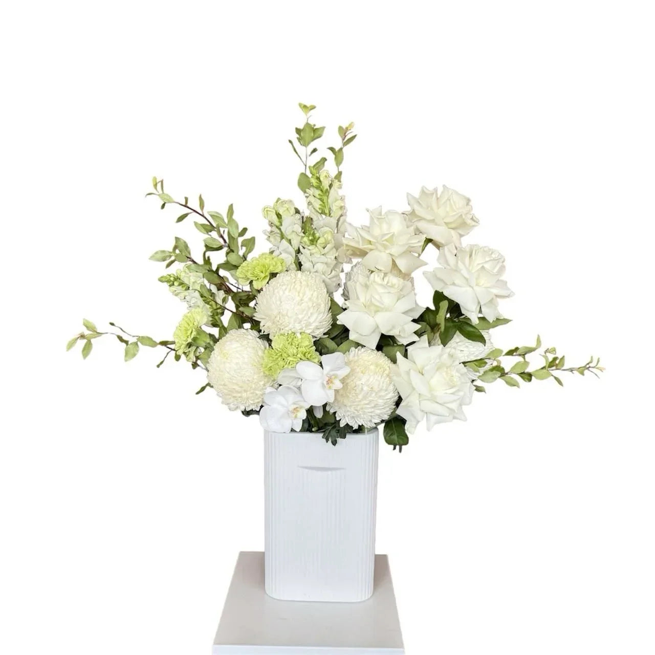 Moonlit Garden arrangement of white flowers and greenery in a white ceramic vase by Vhouse Florist