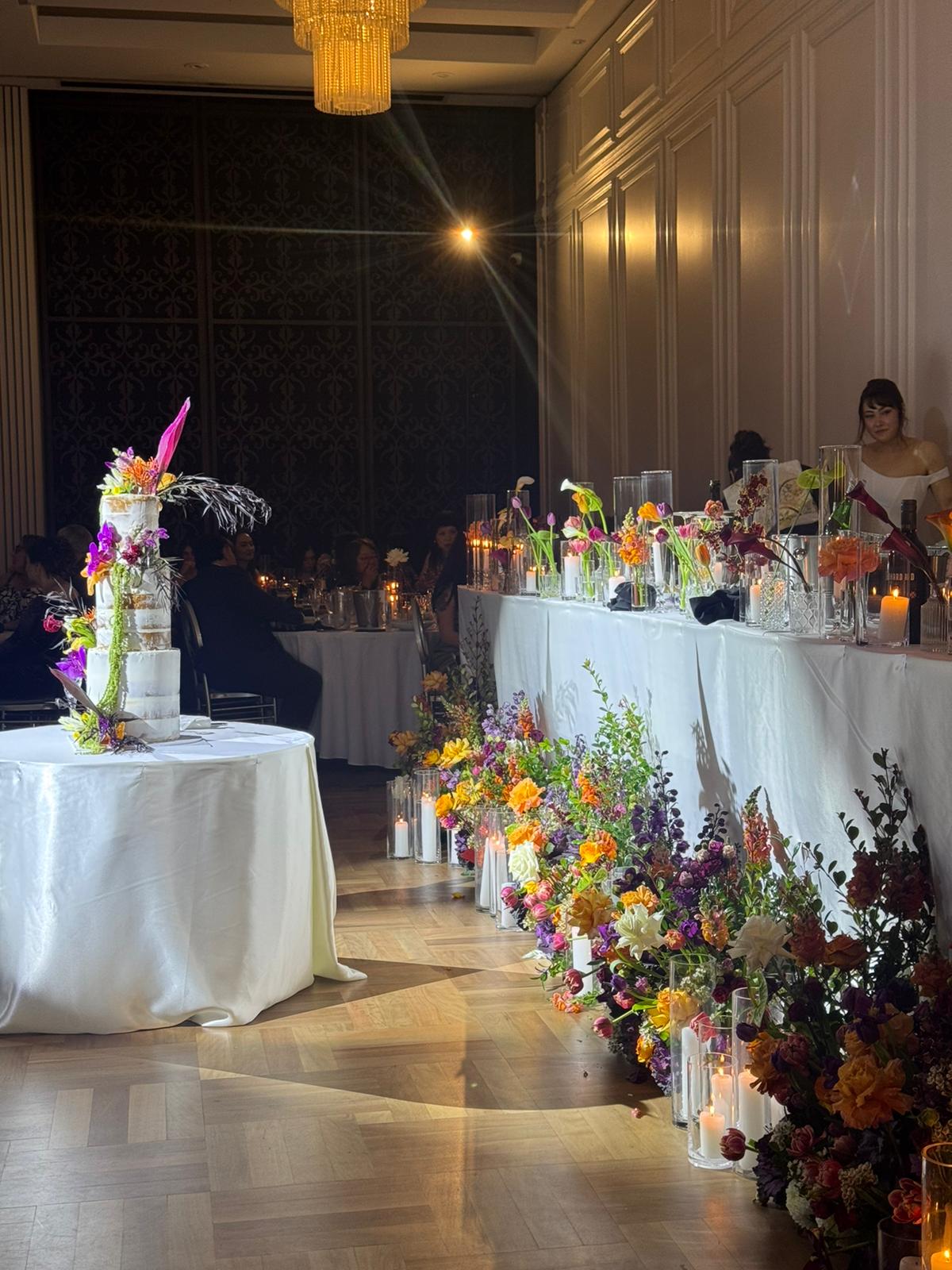 Plum, burgundy, ivory and apricot Sydney wedding flowers with candlelight by Vhouse Florist