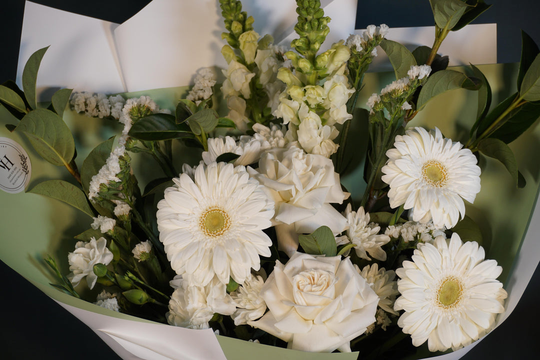 Close-up of Pearl Meadow with white roses, gerberas and fresh greenery from Vhouse Florist