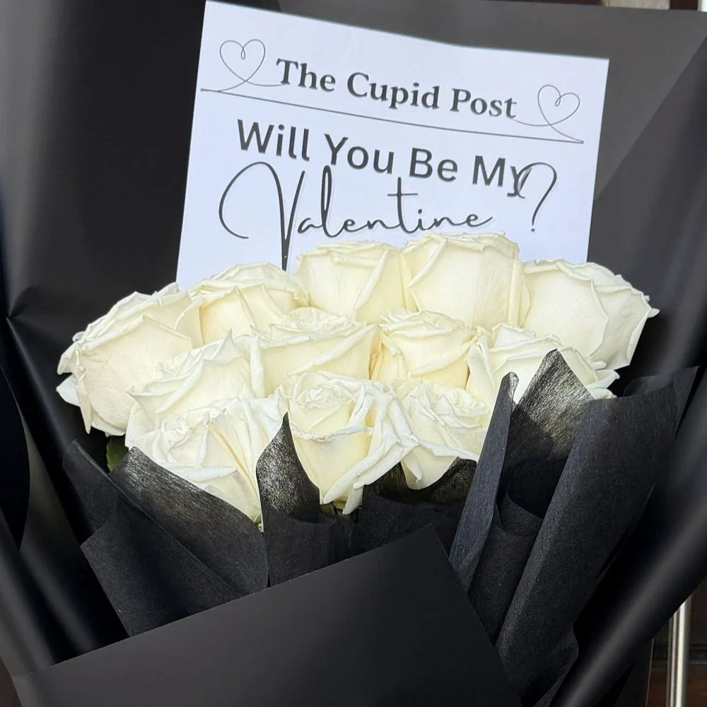 Close-up of 12 white roses bouquet in black paper with romantic gift card, Sydney same-day luxury white rose delivery and elegant flower gifts by Vhouse Florist