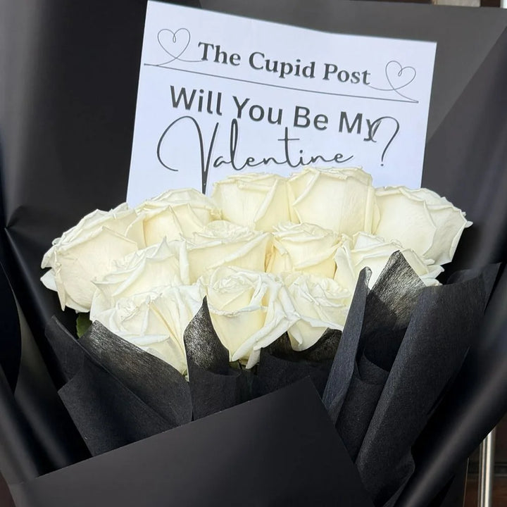 Close-up of 12 white roses bouquet in black paper with romantic gift card, Sydney same-day luxury white rose delivery and elegant flower gifts by Vhouse Florist