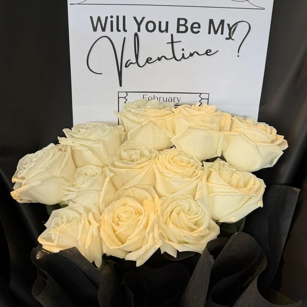 Close-up of 12 white roses bouquet in black paper with romantic gift card, Sydney same-day luxury white rose delivery and elegant flower gifts by Vhouse Florist