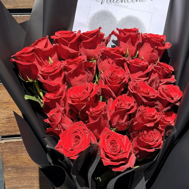 Close-up of 24 luxury red roses bouquet in black paper with romantic heart card, Sydney same-day luxury red rose delivery and romantic flower gifts by Vhouse Florist
