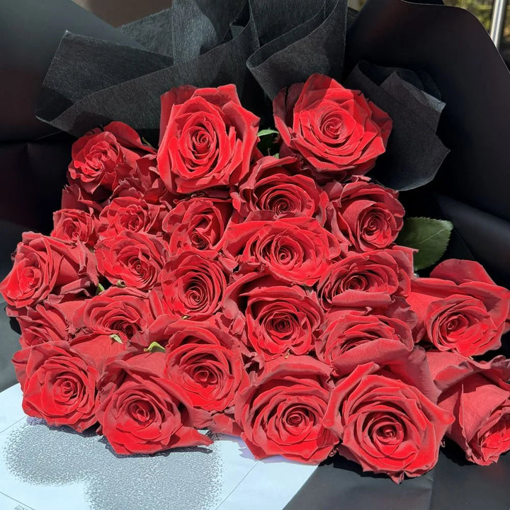 24 luxury red roses bouquet close-up overhead view wrapped in black paper, Sydney same-day luxury red rose delivery and romantic flower gifts by Vhouse Florist