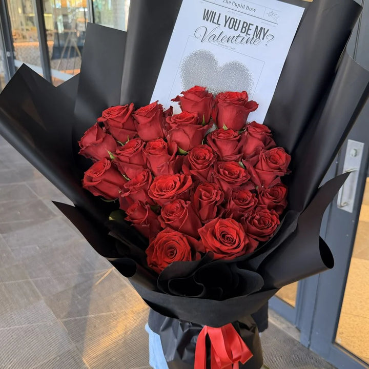 24 luxury red roses bouquet wrapped in black paper delivered to doorstep with romantic gift card, Sydney same-day luxury red rose delivery and romantic flower gifts by Vhouse Florist