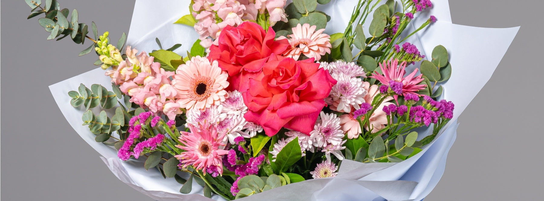 Red rose and light pink flower bouquet