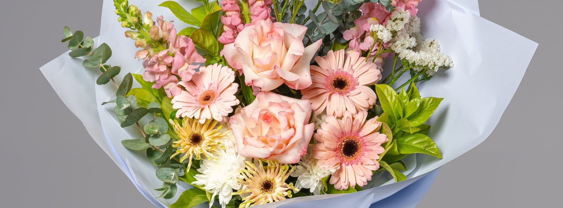 Pastel pink flower bouquet with greenery