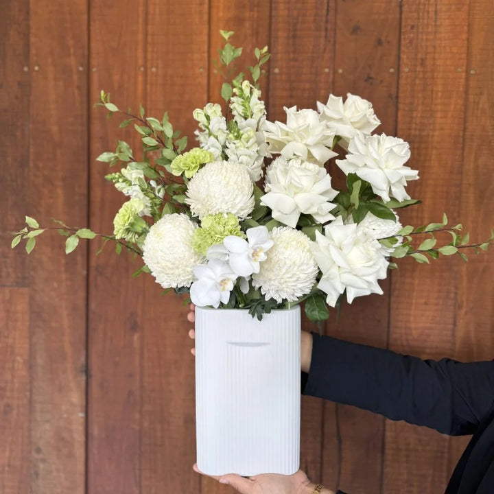 White Flower Bouquet with Greenery in White ceramic vase