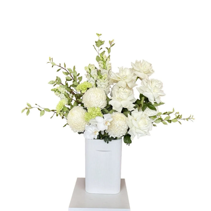 White Flower Bouquet with Greenery in White ceramic vase