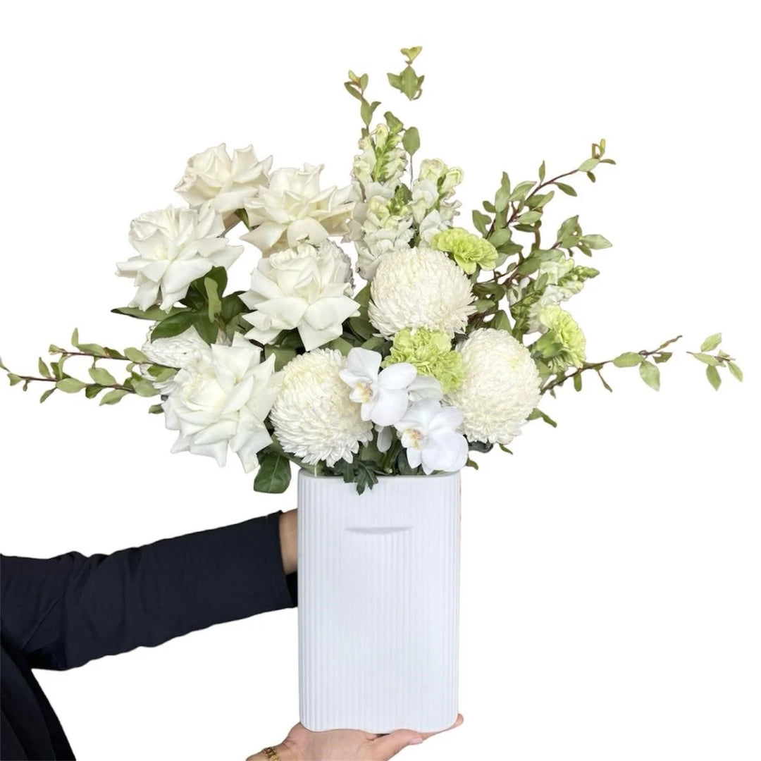 White Flower Bouquet with Greenery in White ceramic vase