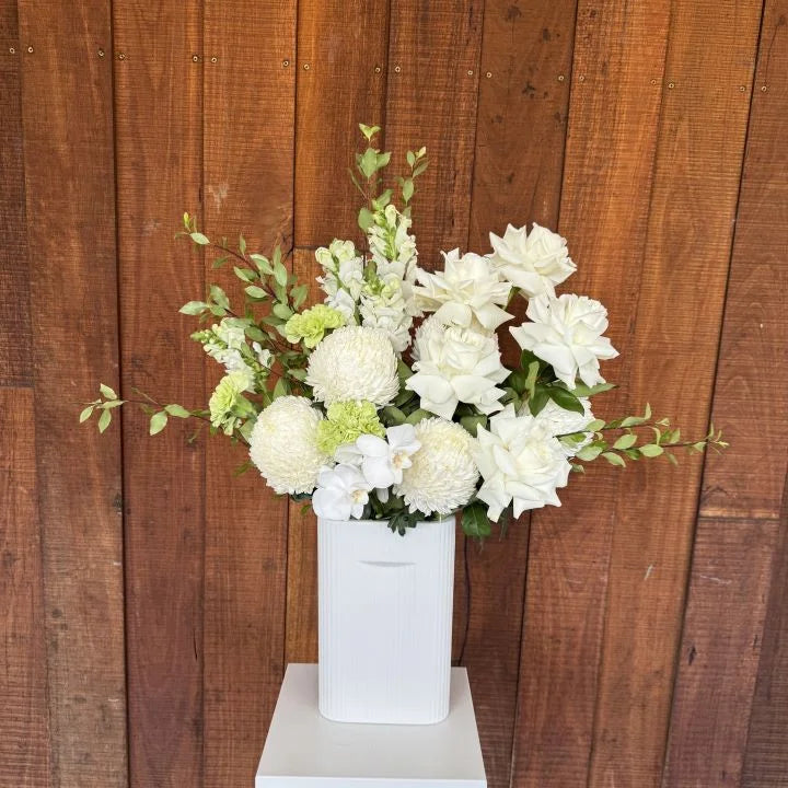 White Flower Bouquet with Greenery in White ceramic vase