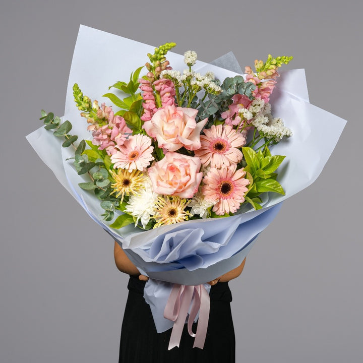 classic size bouquet of light pink flowers