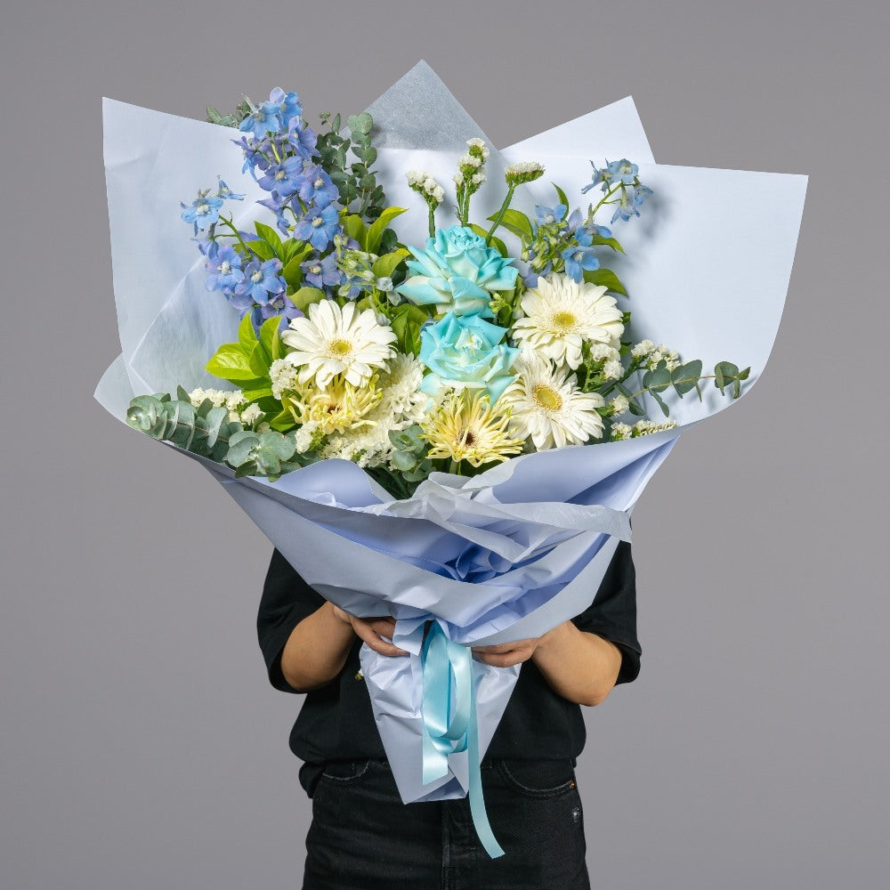 Blue Sky flower bouquet with white blooms and soft blue accents for gifting