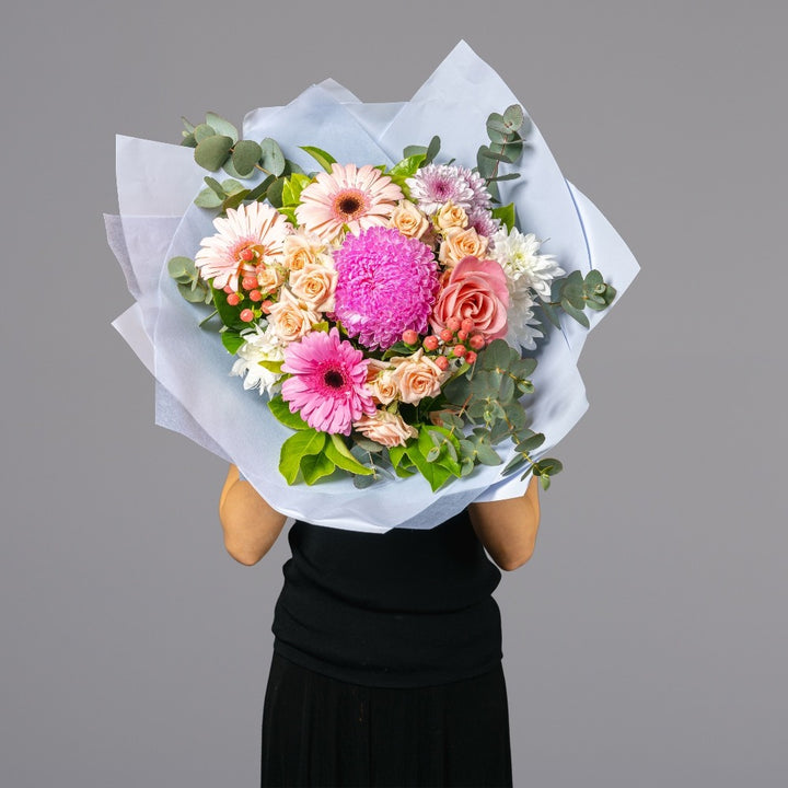 Round bouquet of pink and pastel pink flowers