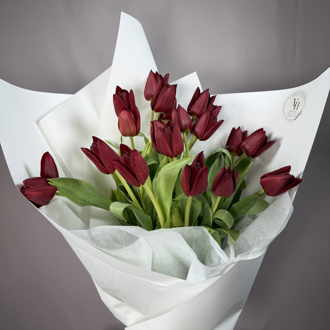 Deep burgundy wine tulip wrapped bouquet