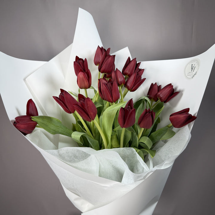Deep burgundy wine tulip wrapped bouquet