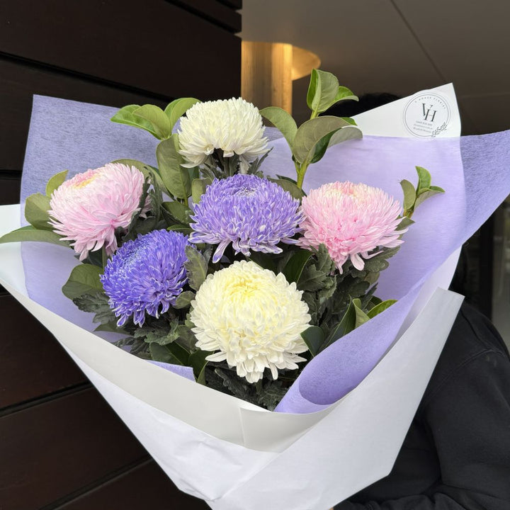 Luxury chrysanthemum bouquet with purple, soft pink and cream flowers wrapped in white and purple paper, Vhouse Florist Sydney same-day delivery