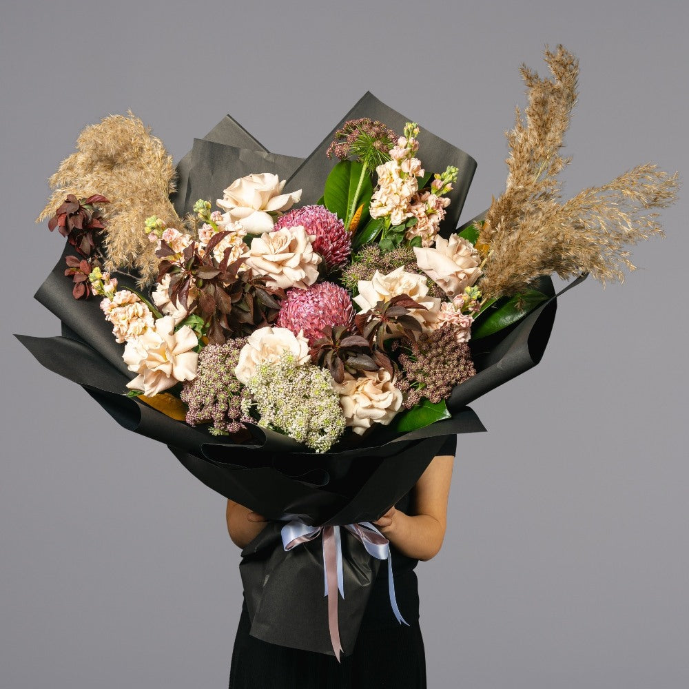 Mixed arrangement of fresh and native flowers