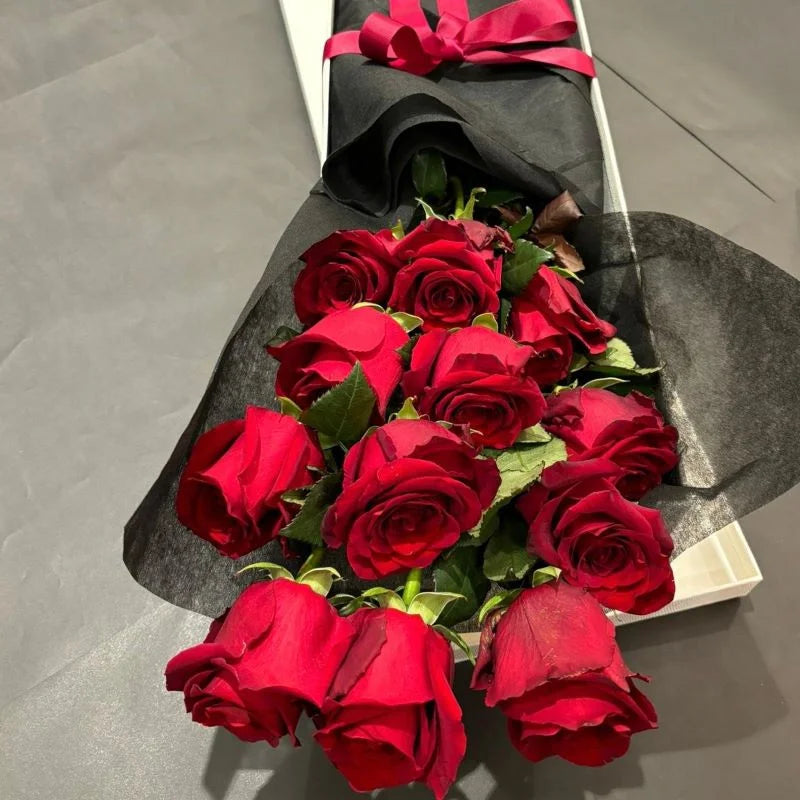 Red roses in long black wrap box on grey background, Sydney luxury red rose gift box delivery by Vhouse Florist