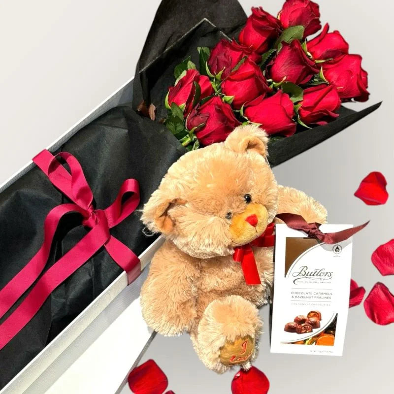 Luxury romantic gift set with red roses in black wrap, teddy bear and chocolates on silver background, Sydney same-day luxury flower and gift delivery by Vhouse Florist