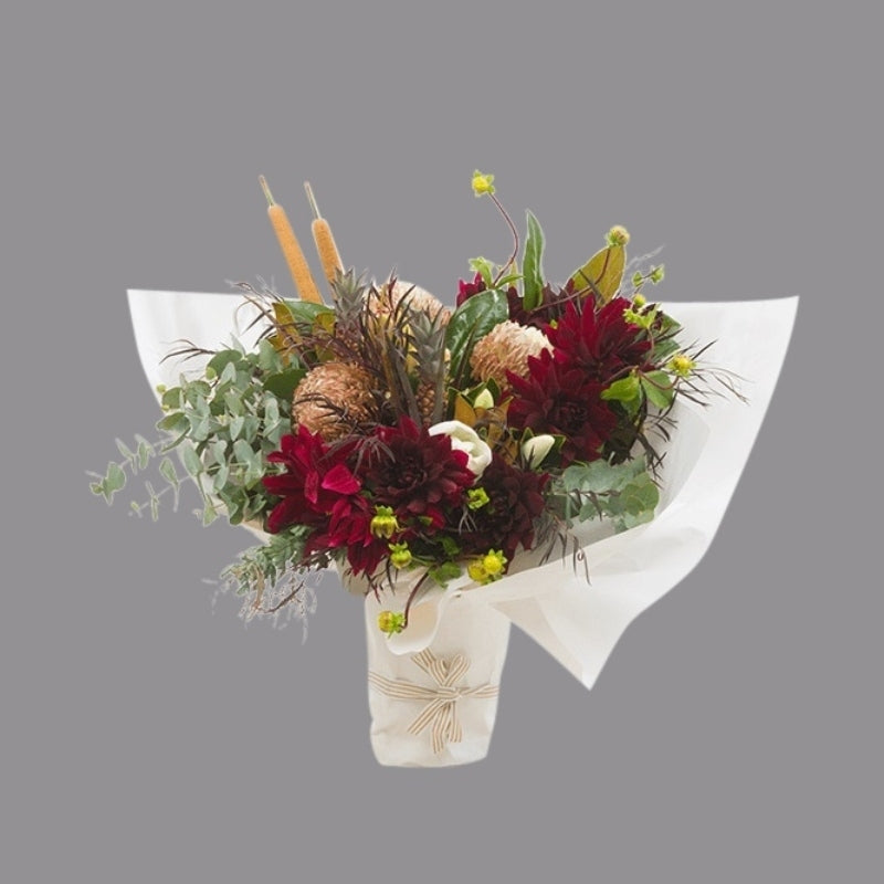 Bright red and light pink fresh flowers in paper wrap