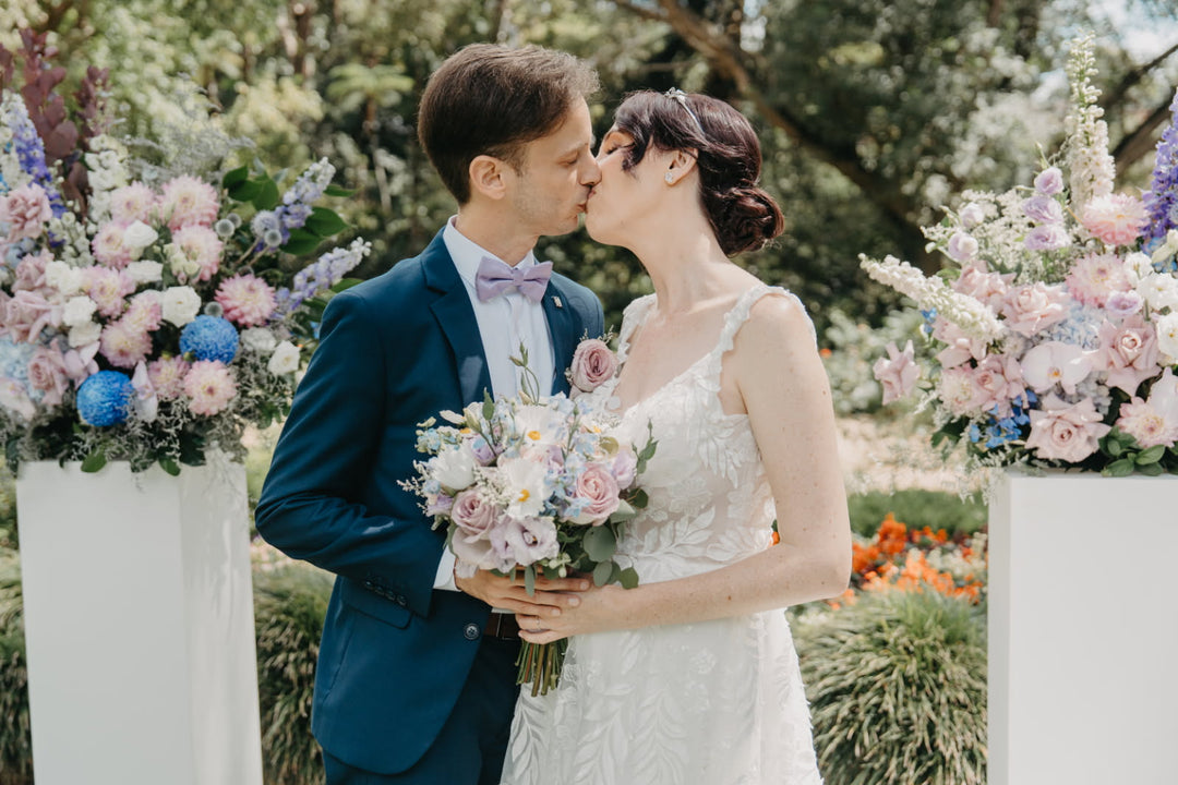 Wedding ceremony with pastel flowers on plinths