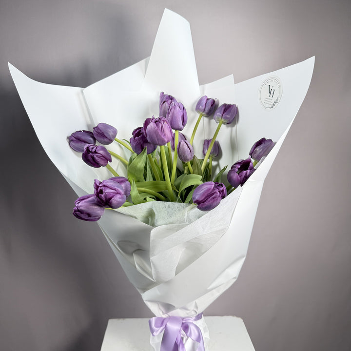 Violet purple tulip wrapped bouquet
